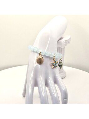 Ocean-Inspired Stretch Bead Bracelet With Starfish Shell And Conch Charms